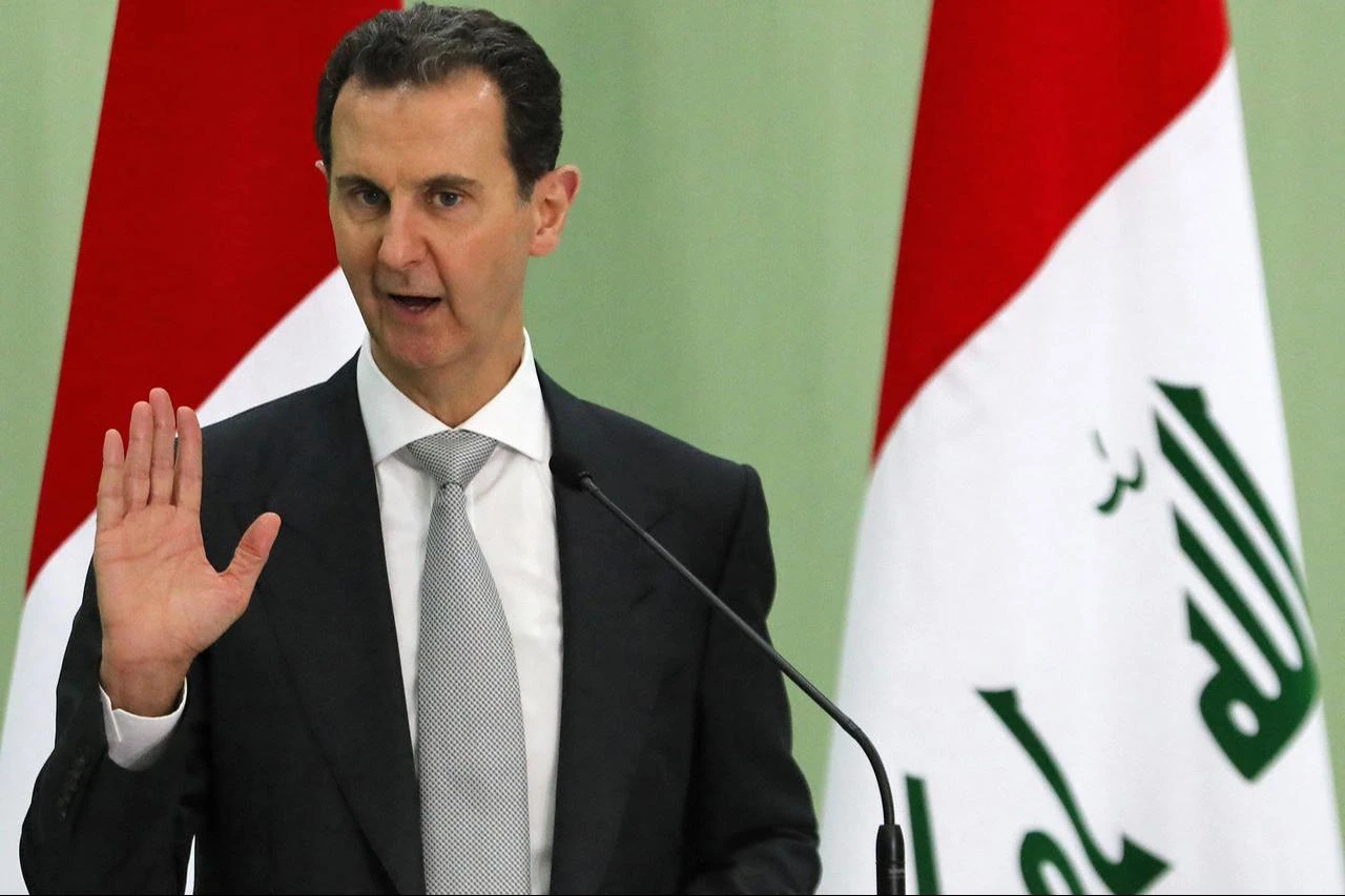Then-Syria's President Bashar Assad speaks during a press conference with Iraq's Prime Minister in Damascus on July 16, 2023. (AFP Photo)