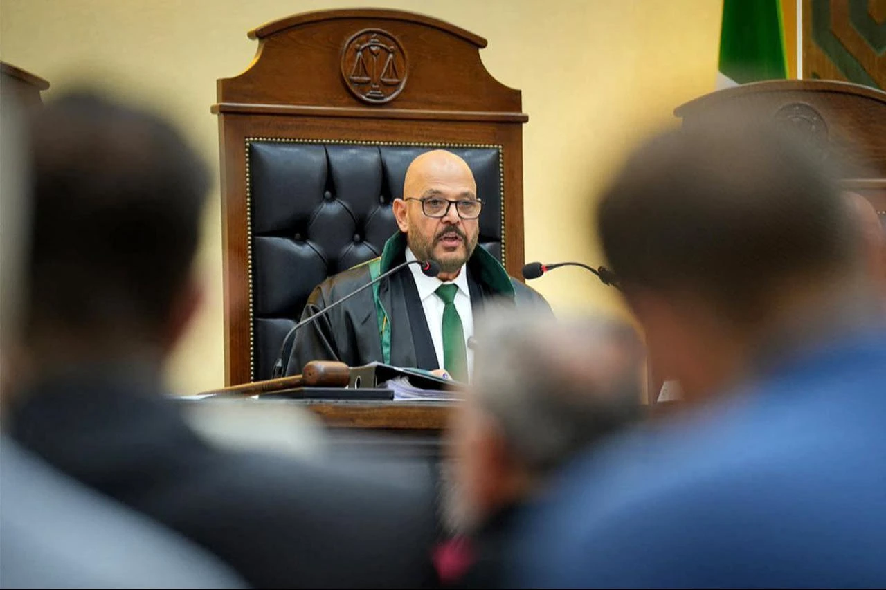 Judge Fakhr al-Din al-Aryan speaking at a court in Damascus on August 11, 2026. (AFP Photo/SANA /Handout)