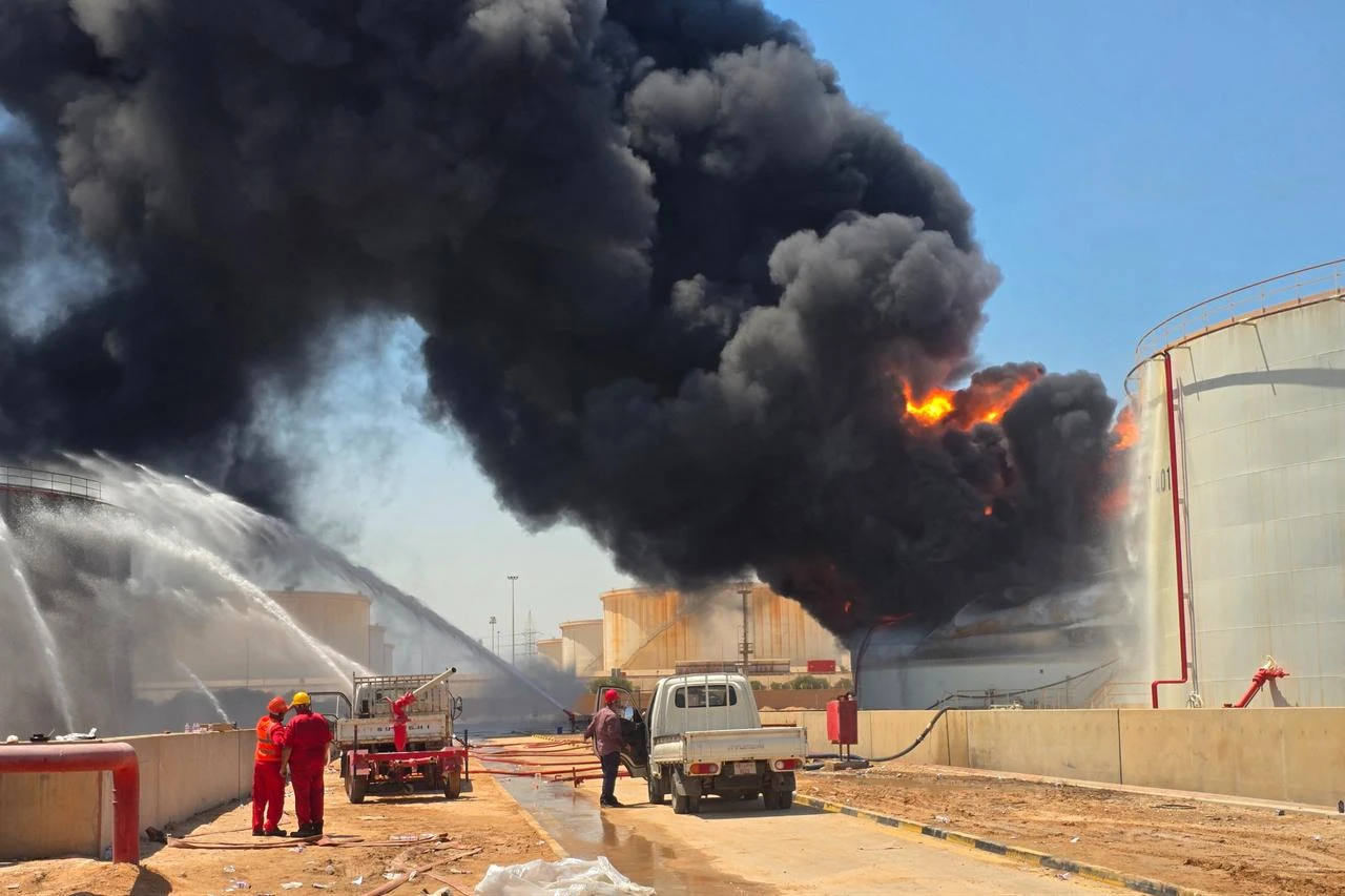 Libyan firefighting teams attempt to extinguish a fire at the Zawiya refinery in al-Zawiyah on August 11, 2026. (AFP Photo)