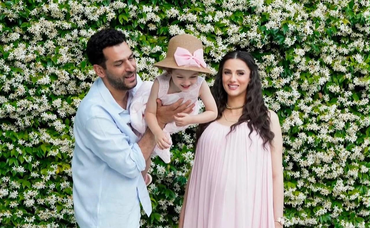 Murat Yildirim and Iman Elbani pose with their daughter Miray as the couple announce that they are expecting another child. (Photo via Instagram/@mrtyldrm and @iman_elbani)