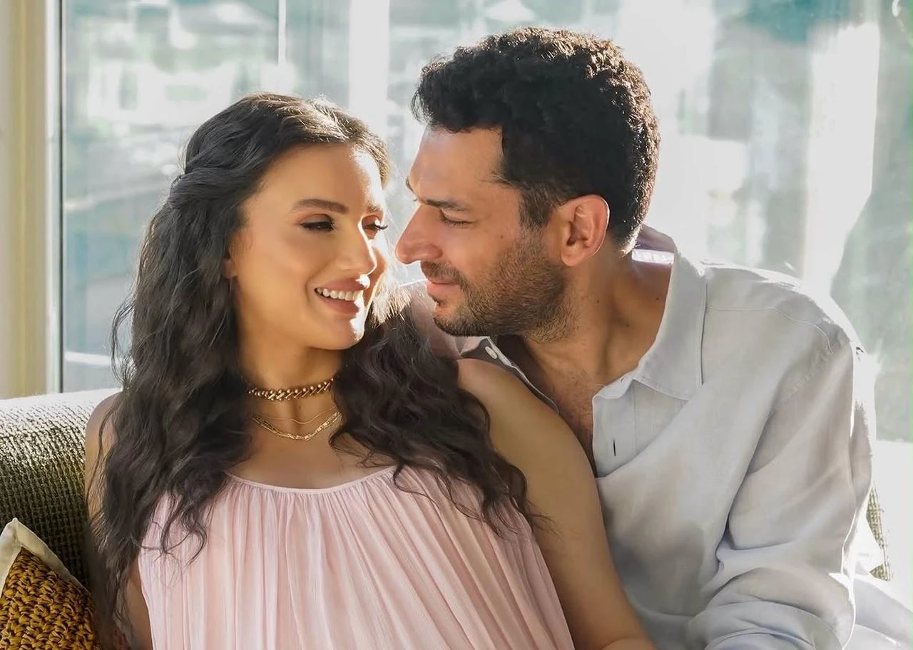 Iman Elbani and Murat Yildirim pose together in a photograph marking the couple's pregnancy announcement. (Photo via Instagram/@mrtyldrm and @iman_elbani)