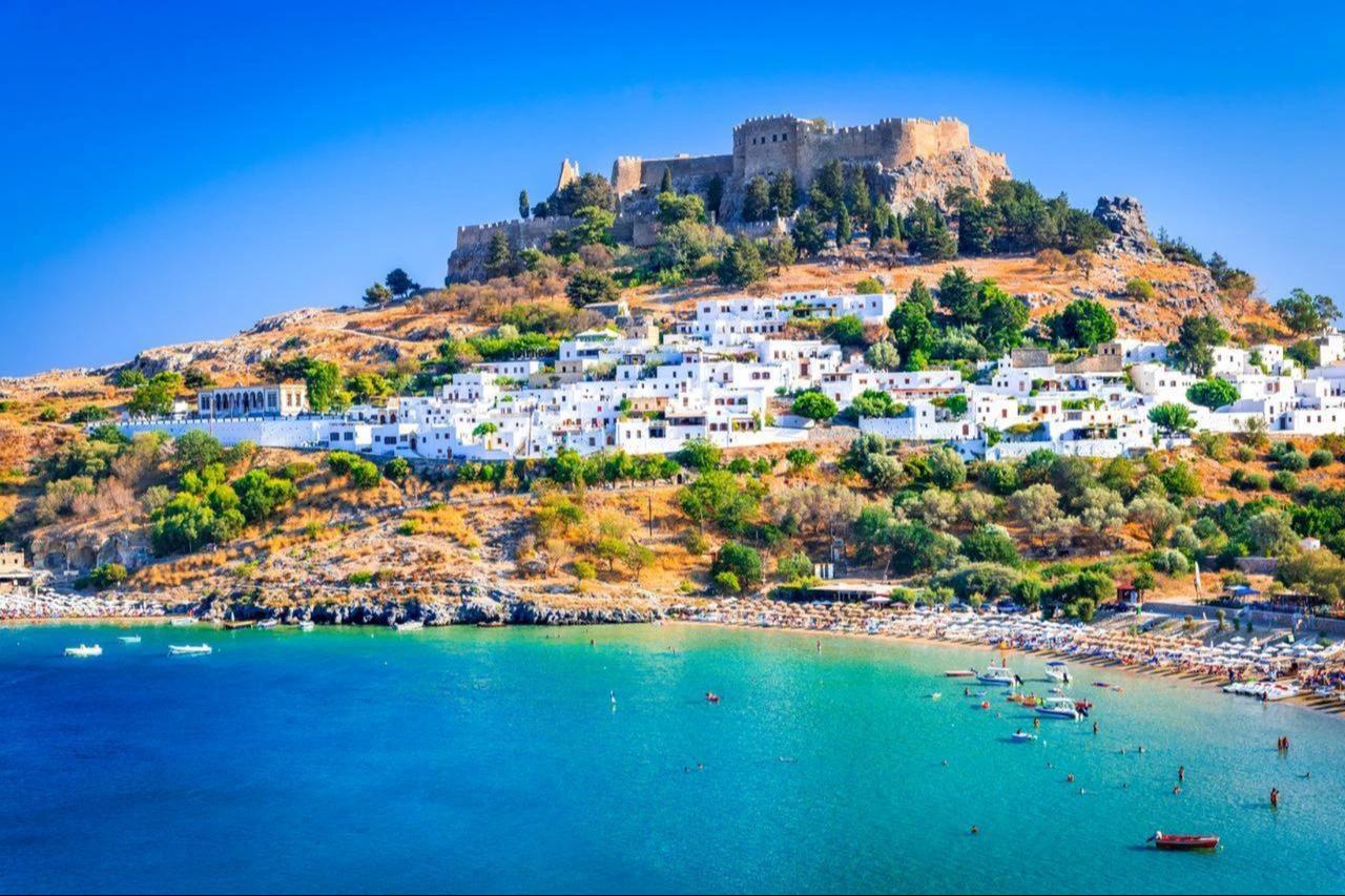 The ancient Acropolis of Lindos, one of Rhodes’ most iconic landmarks in Greece. (Adobe Stock Photo)