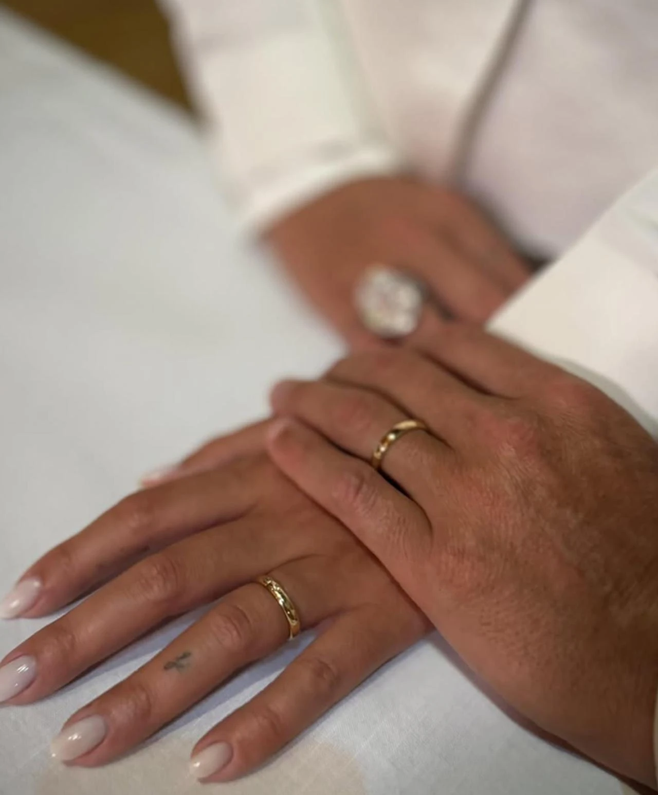 Screenshot showing the couple's wedding rings with the caption "C (heart) G." (Photo via Instagram/@cristiano)