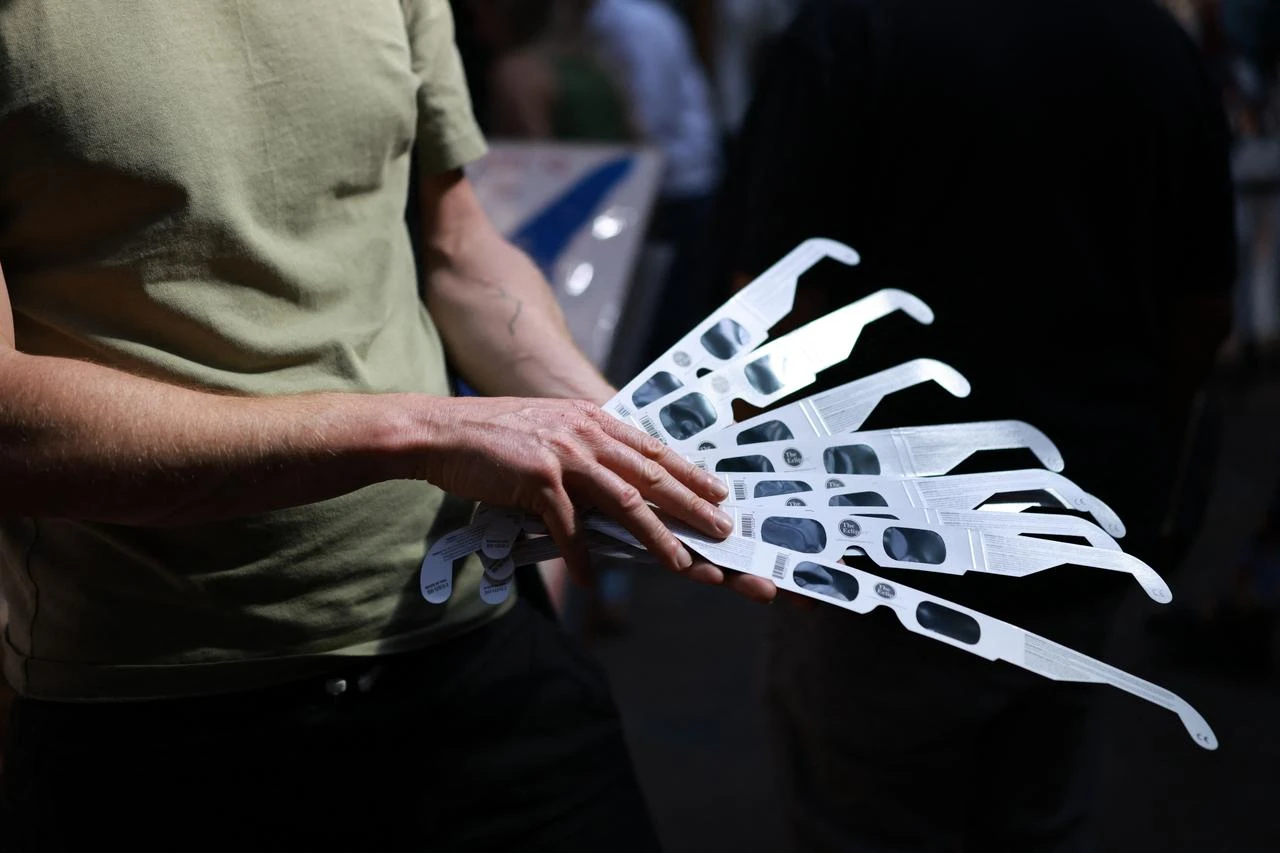 Solar eclipse glasses are displayed for sale at an outlet within Old Spitalfields Market in east London on August 11, 2026, ahead of the total eclipse of the sun expected in parts of Europe the following day. (AFP Photo)