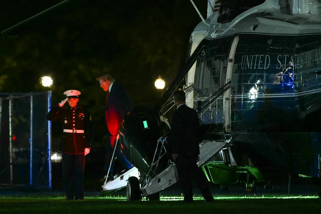 US President Donald Trump steps off Marine One after landing on the Ellipse near the White House in Washington, DC, on August 11, 2026. (AFP Photo)