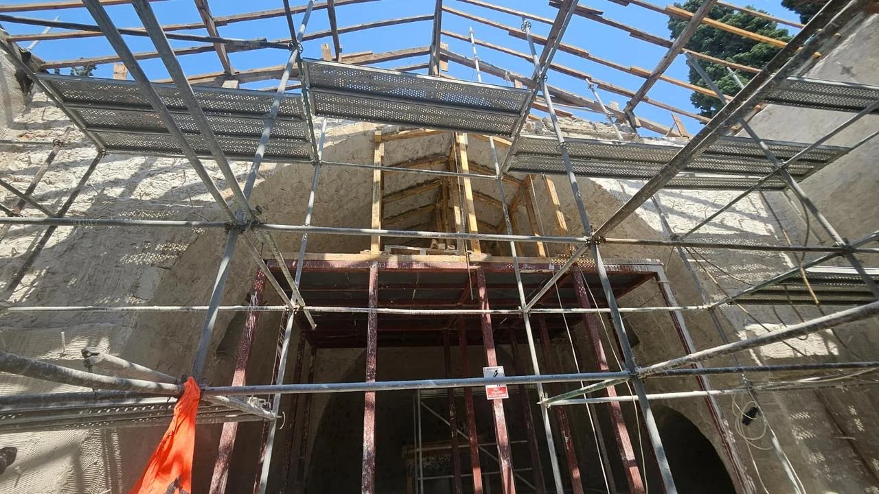 Workers carry out restoration work on the walls of the historic St. George Greek Orthodox Church in Iskenderun, Hatay, Türkiye, Aug. 13, 2026. (IHA Photo)