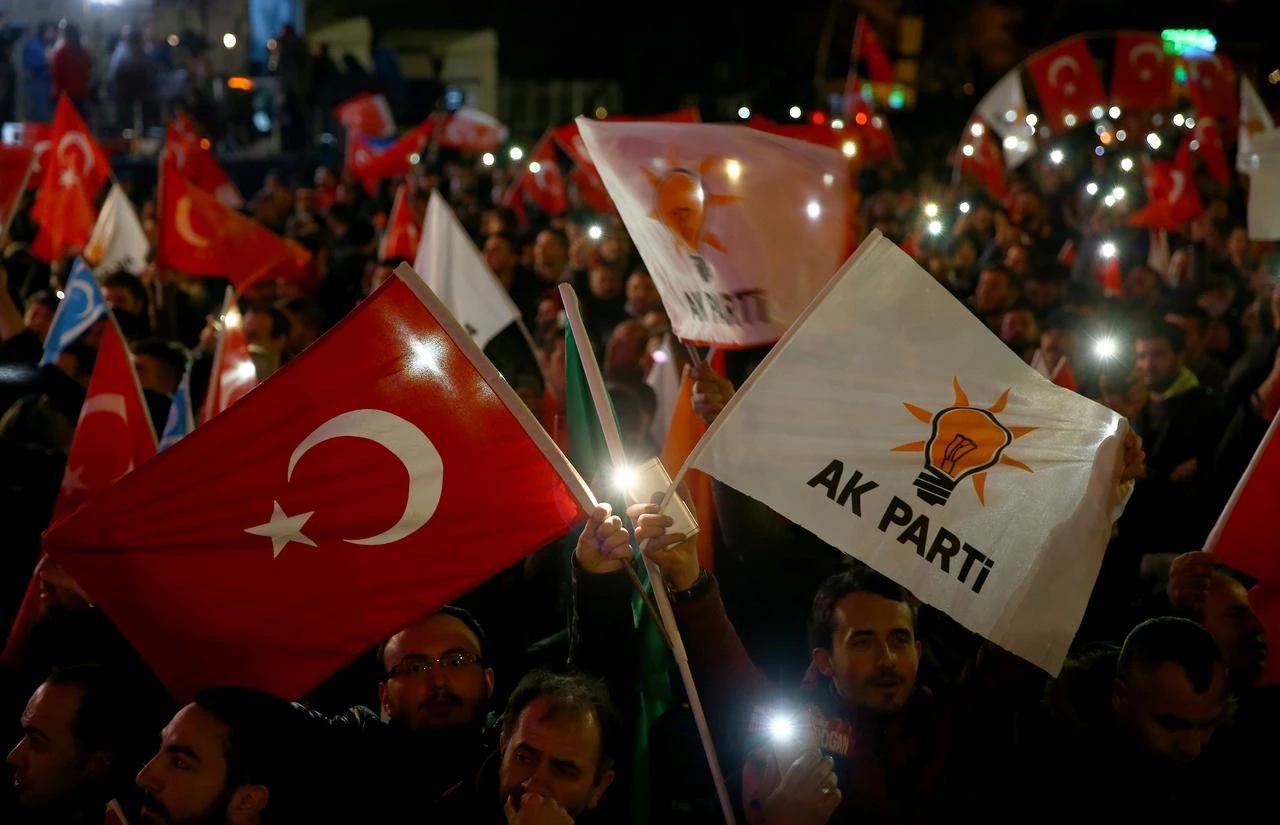 People holding banners and flags gather as President of Turkey and leader of the Justice and Development Party (AK Party), Recep Tayyip Erdogan addressing from the balcony of AK Party's Headquarters in Ankara, Türkiye on April 01, 2019. (AA Photo)