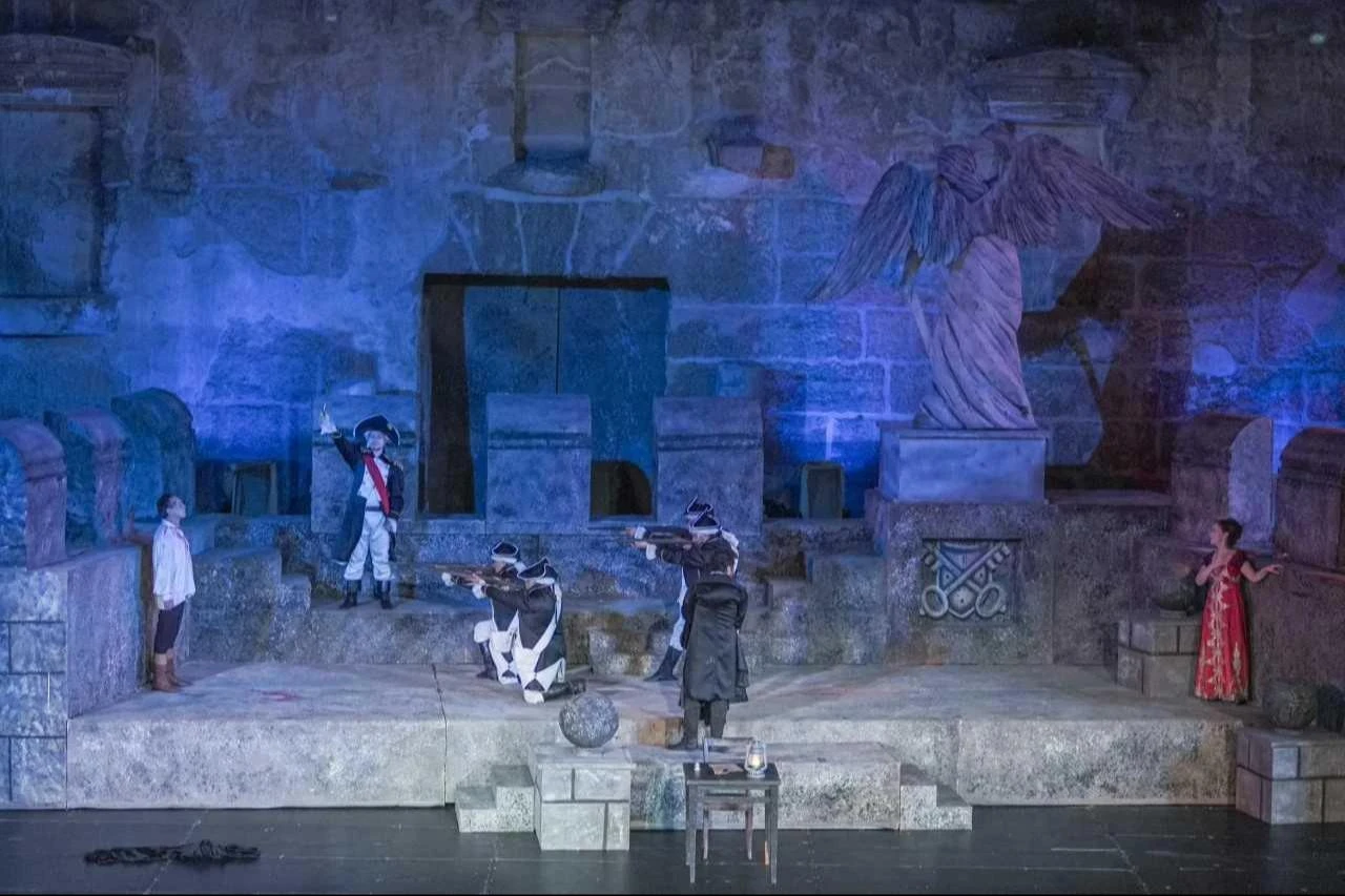 Performers enact a dramatic scene from Puccini’s Tosca during the International Aspendos Opera and Ballet Festival at the ancient theater of Aspendos in Antalya, Türkiye. Sept. 28, 2025. (AA Photo)