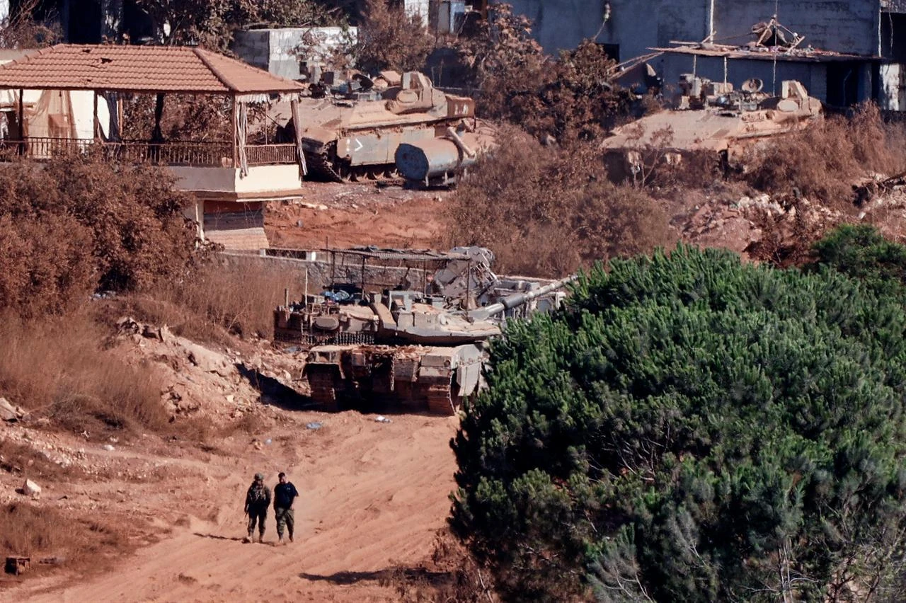 A photograph taken from the southern Lebanese viallage of of Zawtar al-Gharbiyah shows Israeli troops stationed in the nearby village of Zawtar al-Charkiyah, August 11, 2026.  (AFP Photo)