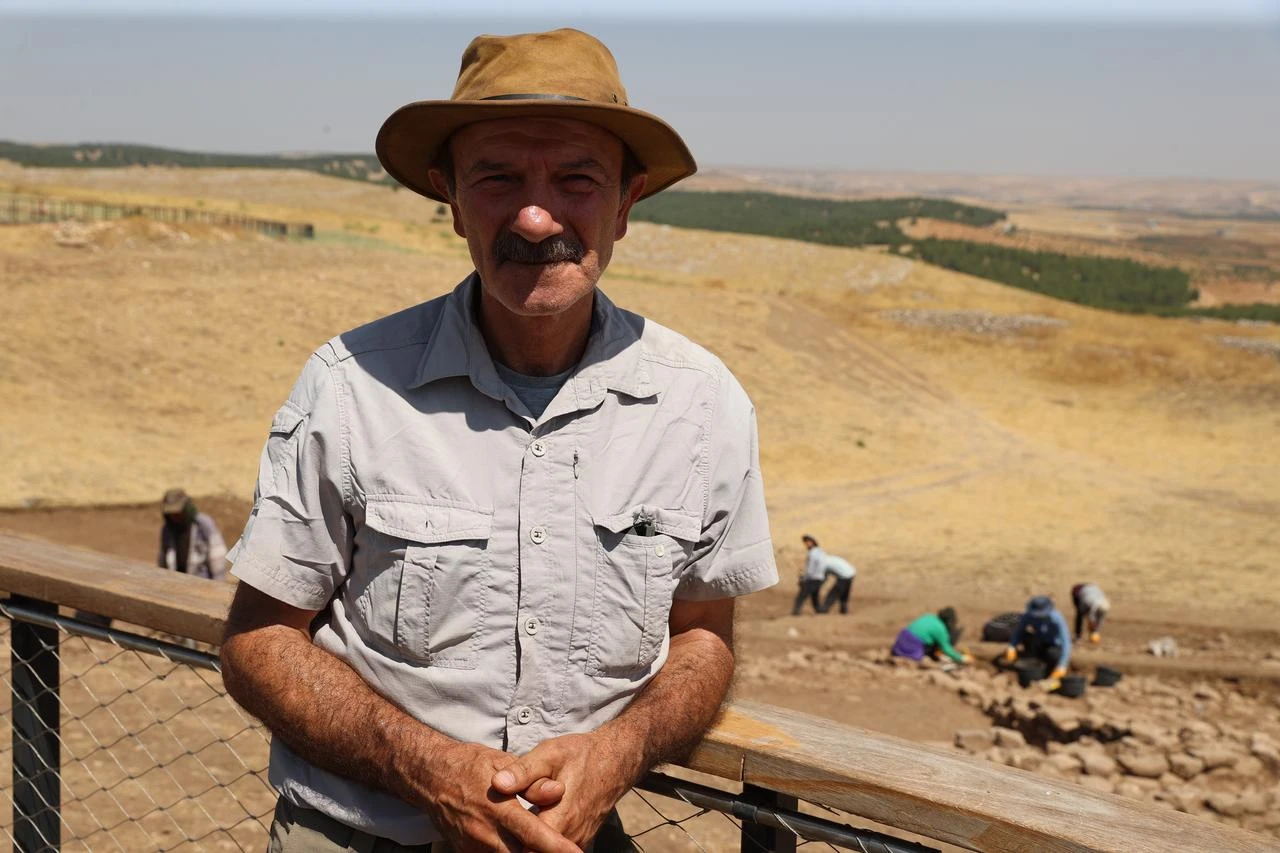 Professor Necmi Karul, head of the Gobeklitepe excavations, stands near the newly opened excavation area at the prehistoric site in Sanliurfa, Türkiye. (AA Photo)