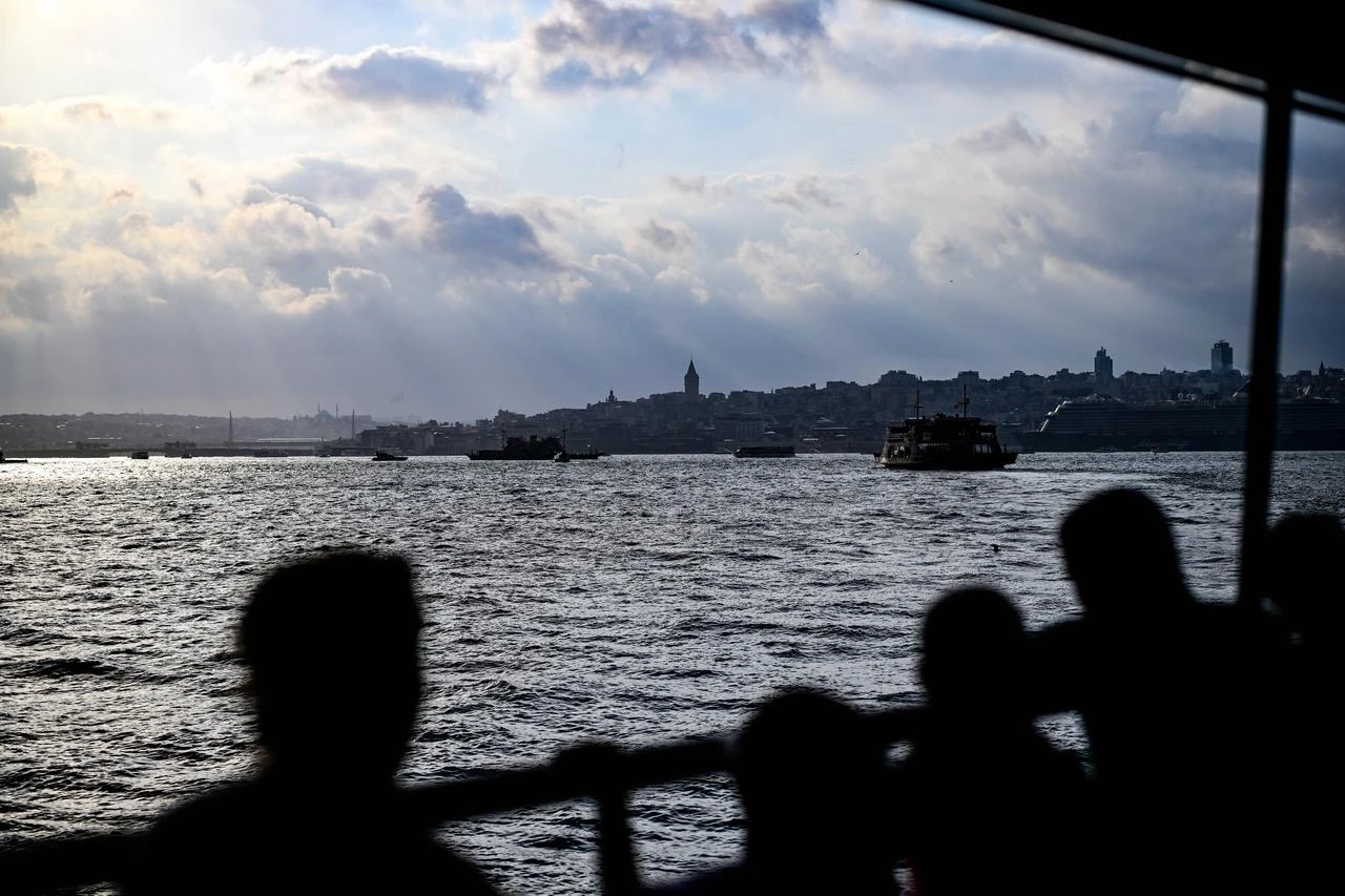People travel across the Bosphorus as cloudy weather continues in Istanbul, Türkiye, on August 9, 2026. (AA Photo)