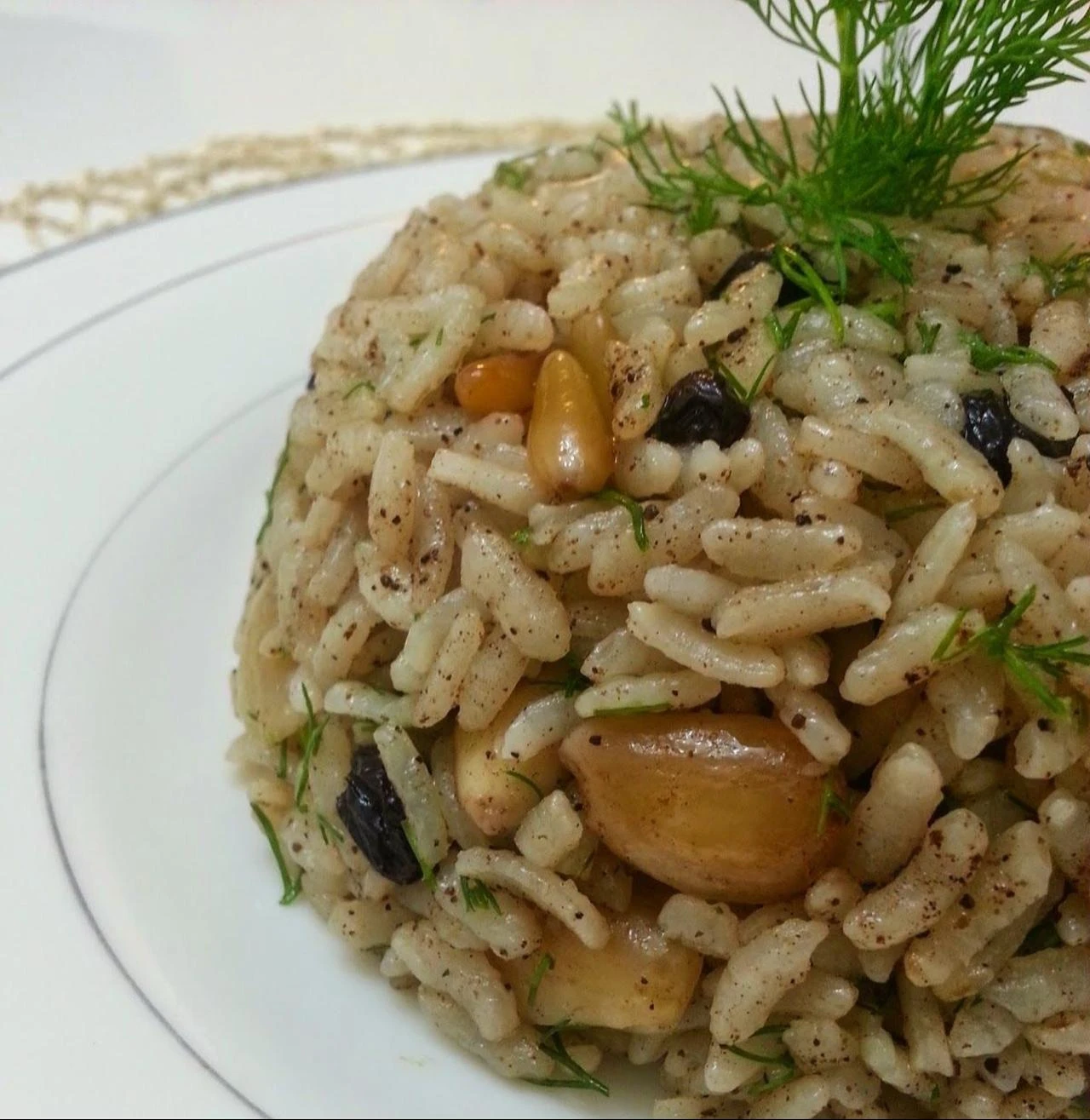 Acem pilavi, a traditional Turkish rice dish served with pine nuts, almonds, currants and fresh dill. (Photo via Pinterest)