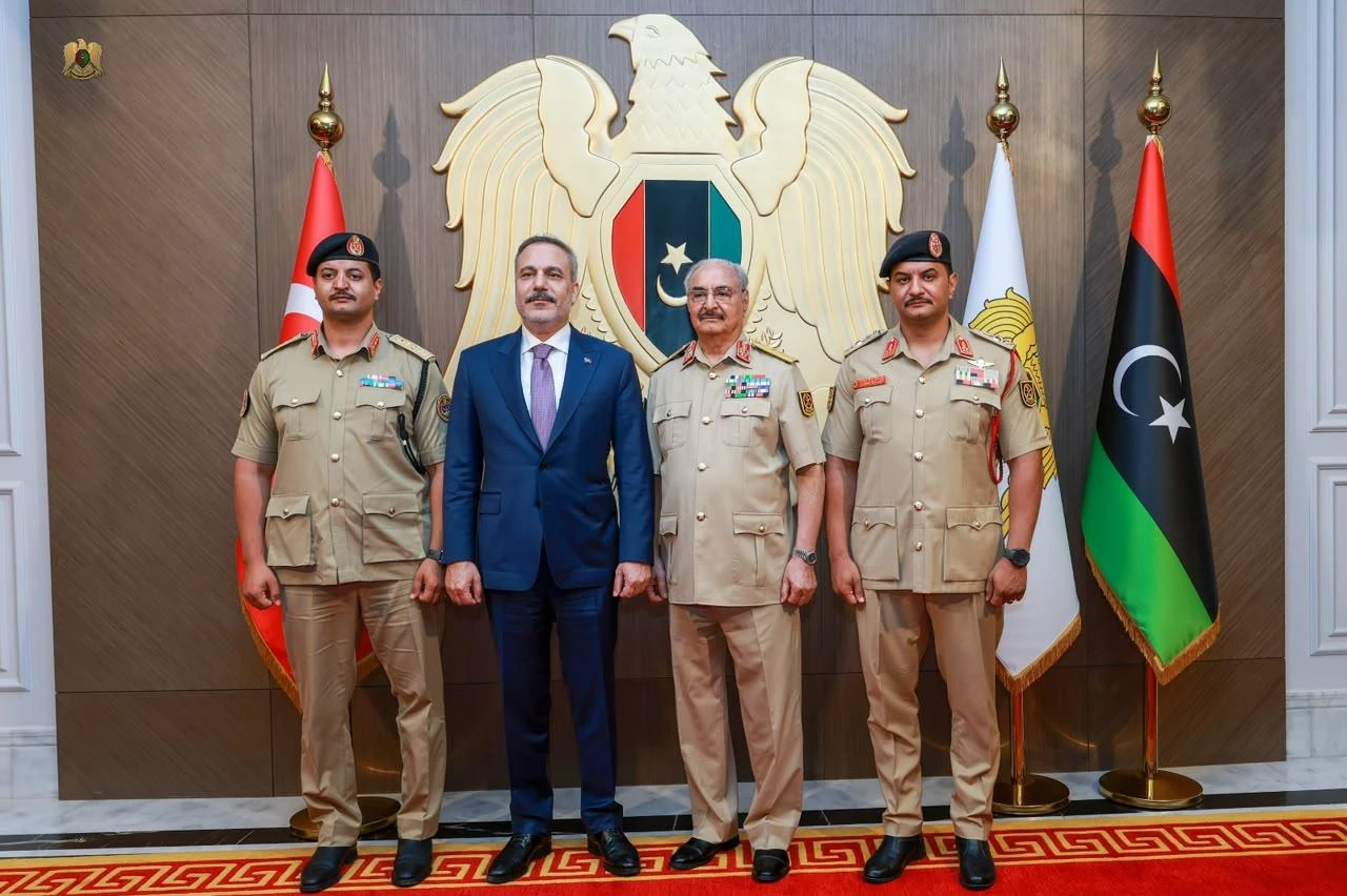 Turkish Foreign Minister Hakan Fidan (L) meets with Commander of the Eastern Libyan Forces, Khalifa Haftar (2nd R) and Gen. Saddam Haftar, (R) deputy commander of the Libyan National Army during his visit in Benghazi, Libya, Aug. 12, 2026. (Turkish Foreign Ministry/HO)