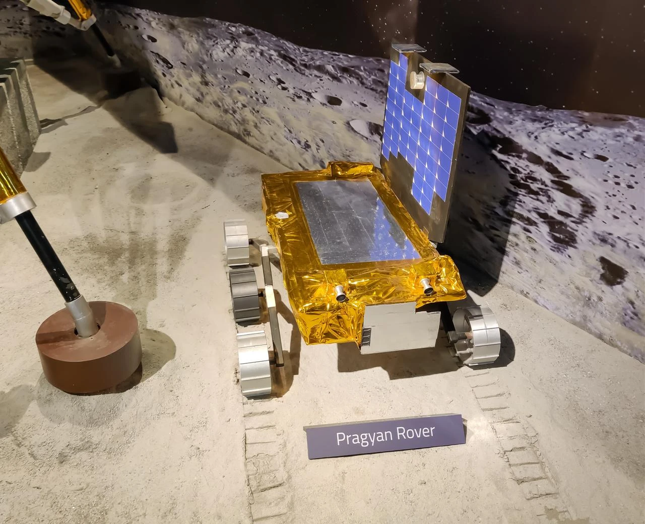 The photo shows the Pragyan Rover model, a symbol of technological triumph in space exploration, poised on a simulated lunar landscape at an unspecified location and time. (Adobe Stock Photo)