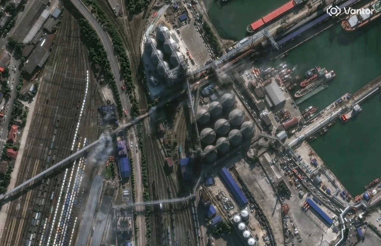 This handout satellite image taken and released by Vantor on August 12, 2026, shows smoke rising near a grain facility at the Black Sea port of Novorossiysk in Russia, following Ukrainian strikes. (AFP Photo/Satellite image ©2026 Vantor/HO)