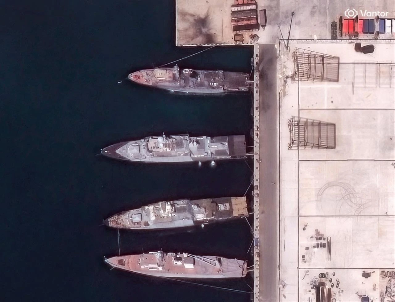 This handout satellite image taken and released by Vantor on August 12, 2026, shows heavily damaged ships at the Black Sea port naval base of Novorossiysk in Russia, following Ukrainian strikes. (AFP Photo/Satellite image ©2026 Vantor/HO)