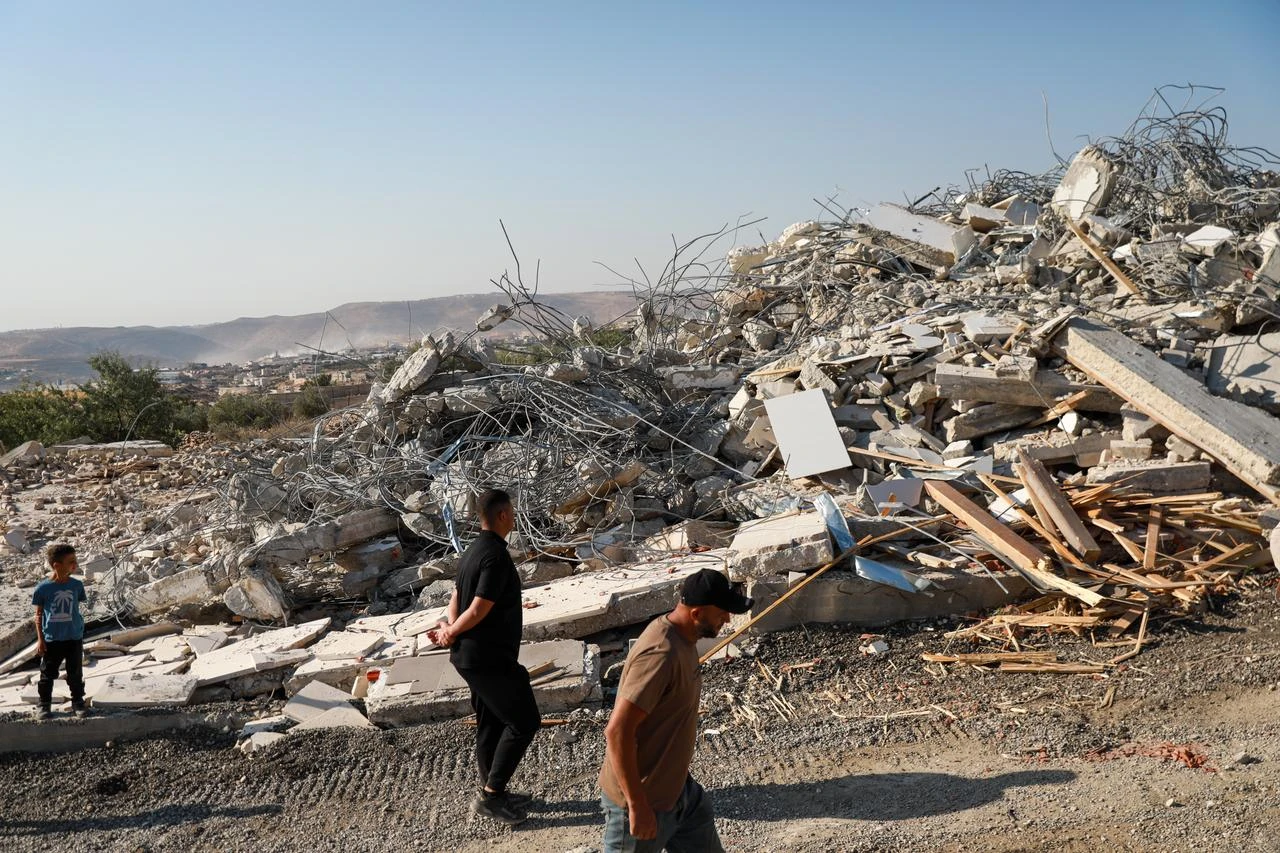 Palestinians inspect the damage following a house demolition by Israeli forces in the village of Al-Masara, near Bethlehem in the West Bank, Palestine on August 12, 2026. (AA Photo)