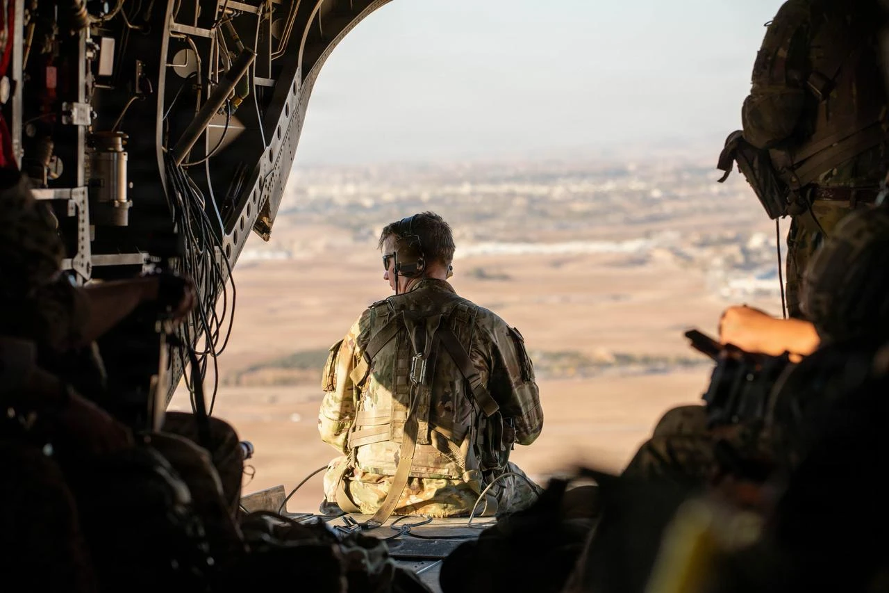 U.S. Army's senior enlisted advisor of Task Force Nighthawk sits at the ramp of a Boeing CH-47 Chinook while being transported to Erbil Air Base, Iraq, following the joint U.S.-German Schützenschnur, Jan 9, 2026. (Photo via U.S. Army)