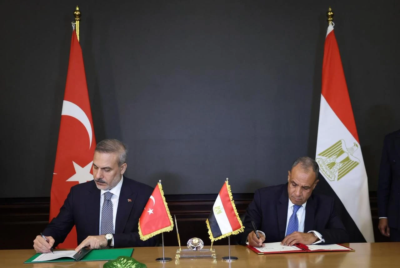 Turkish Minister of Foreign Affairs Hakan Fidan signs bilateral agreements alongside Egyptian Minister of Foreign Affairs, Emigration and Egyptian Expatriates Badr Abdelatty in El Alamein, Egypt, Aug. 13, 2026. (Turkish Foreign Ministry/HO)