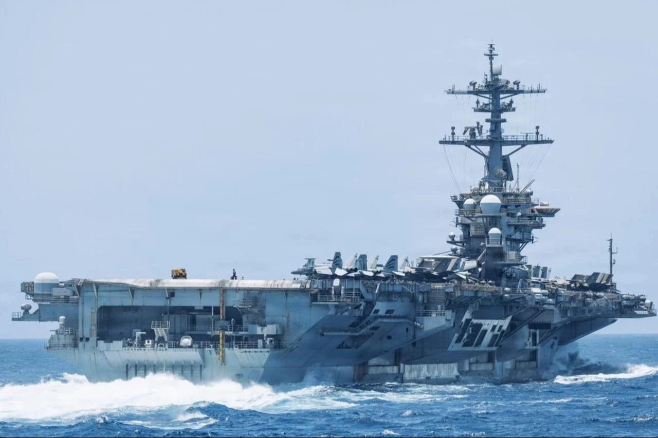 USS Abraham Lincoln (CVN-72) sails through the Arabian Sea while supporting U.S. military operations in the region, date and time undisclosed. (Photo via X/@CENTCOM)