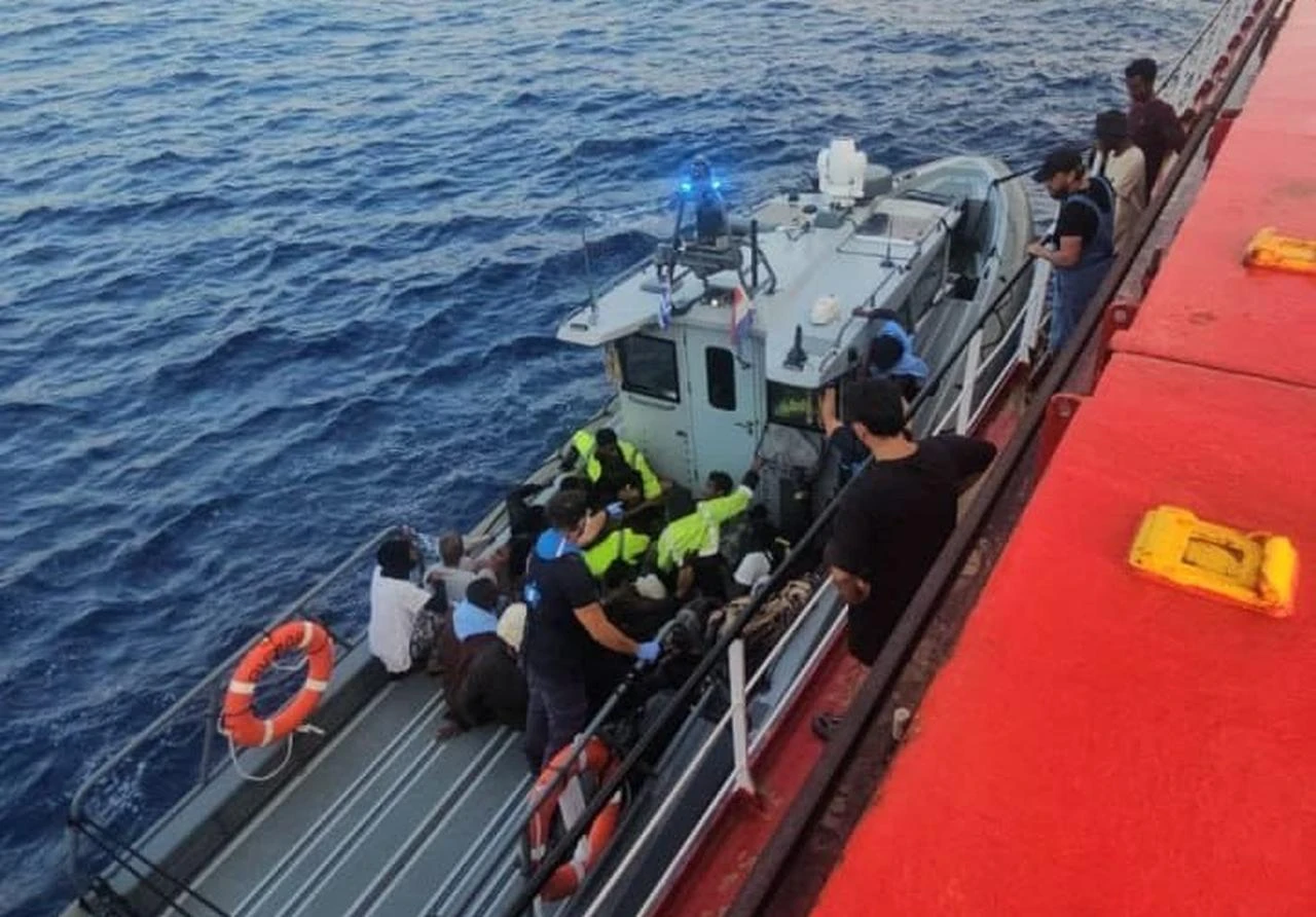 Migrants are transferred from the Turkish-flagged DONAU EKSPRES II to another vessel after being rescued at sea south of Crete, Greece, Aug. 14, 2026. (Photo via X/@denizcilikgm)