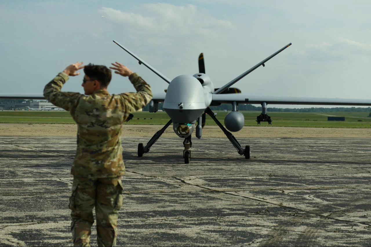 U.S. Air Force Airman 1st Class Ben Mazzei, 214th Aircraft Maintenance Squadron crew chief, Arizona Air National Guard, taxis an MQ-9 Reaper at Battle Creek Air National Guard Base, Michigan, June 29, 2026. (Photo via U.S. Air National Guard)