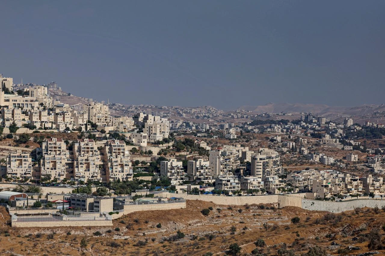 The Israeli illegal settlement of Har Homa, backdropped by the Israeli-occupied Palestinian West Bank city of Bethlehem (R), is seen in the Israel-annexed East Jerusalem on August 14, 2026. (AFP Photo)