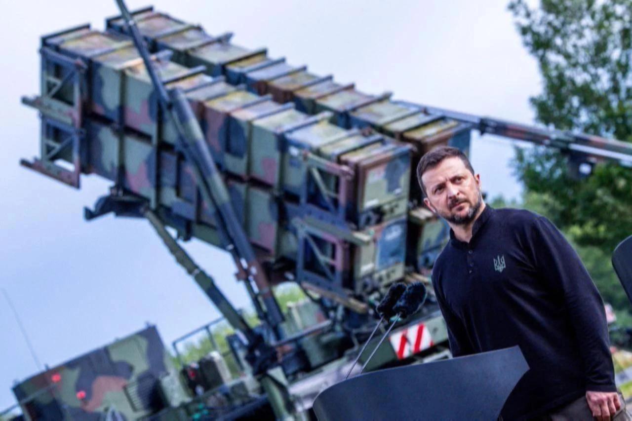 Volodymyr Zelenskyy, President of Ukraine, stands in front of the Patriot air defense missile system at a military training area during a visit to train Ukrainian soldiers on June 11, 2025. (AFP Photo)