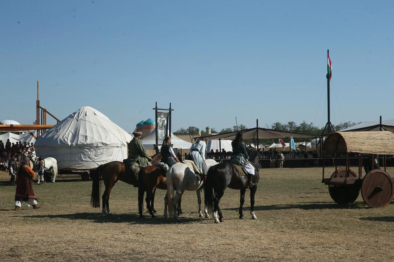 Participants on horseback gather among traditional yurts during the Great Hun-Turkic Kurultaj in Bugac, Hungary. (AA Photo)
