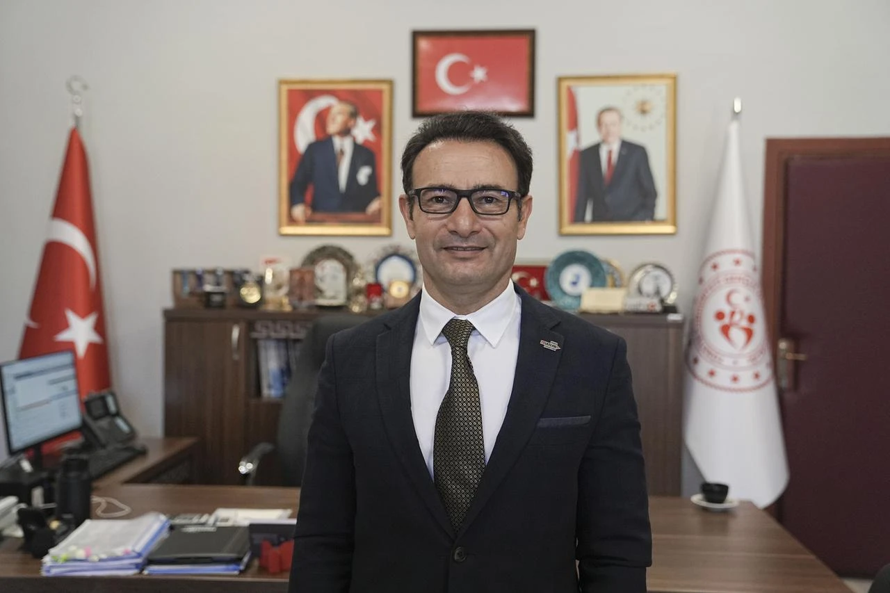 Türkiye Triathlon Federation President Bayram Yalcınkaya poses for a portrait in his office in Türkiye. (AA Photo)