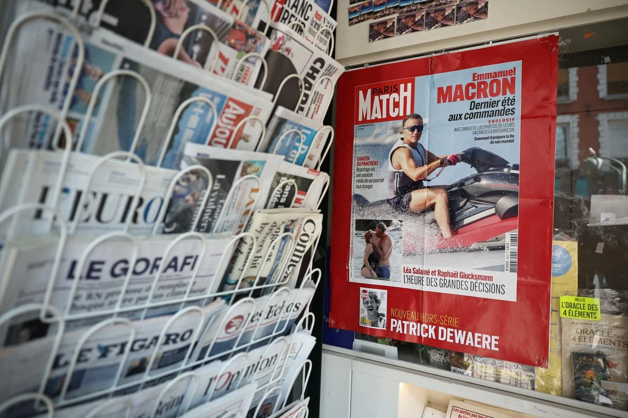 This photograph taken in Paris on August 14, 2026 shows the cover of French magazine "Paris Match" depicting France's President Emmanuel Macron on a jet ski during his holiday near the Presidential residence in Bregancon, south-eastern France. (AFP Photo)