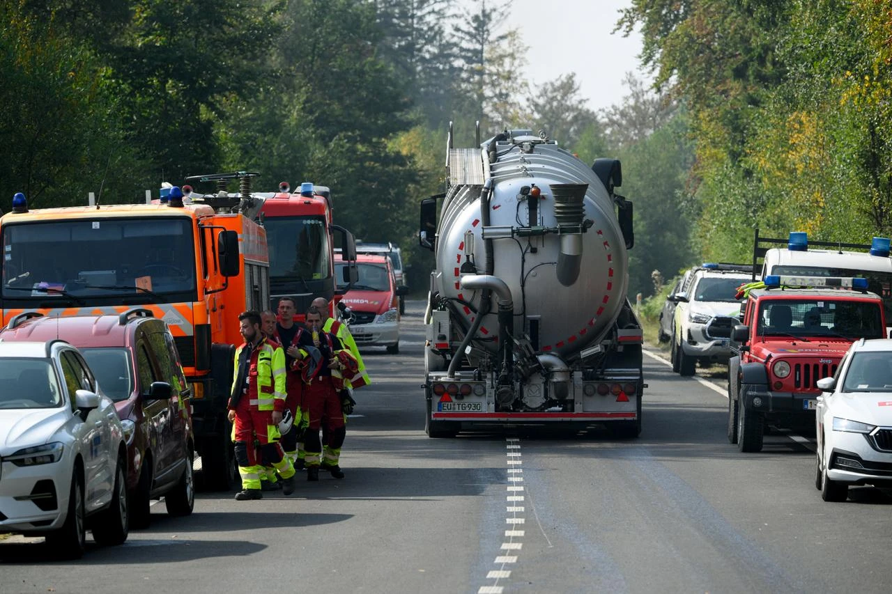 A water tank truck departs from Baelen, near Eupen, eastern Belgium, as firefighters prepare to tackle a wildfire burning in the Hautes Fagnes nature reserve on August 16, 2026. (AFP Photo)