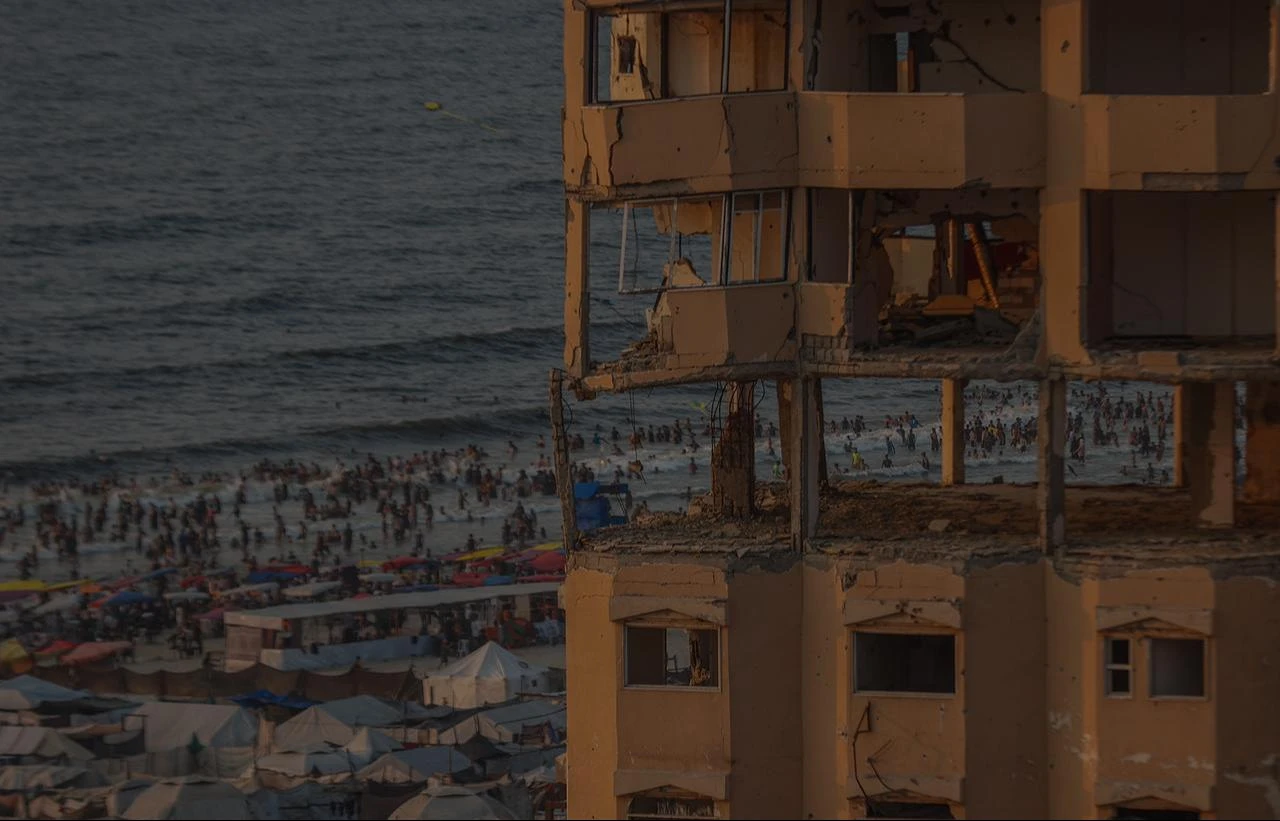 Displaced Palestinians living along the coastal strip of blockaded Gaza City carry out daily activities among the ruins of destroyed buildings during sunset in Gaza, Palestine, Aug. 14, 2026. (AA Photo)