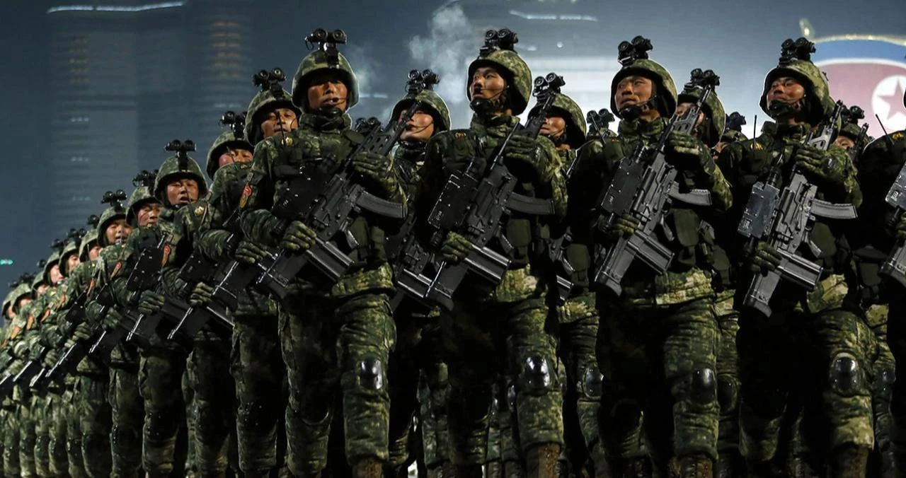 North Korean soldiers march during a nighttime military parade in Pyongyang, North Korea, date and time undisclosed. (AFP Photo)