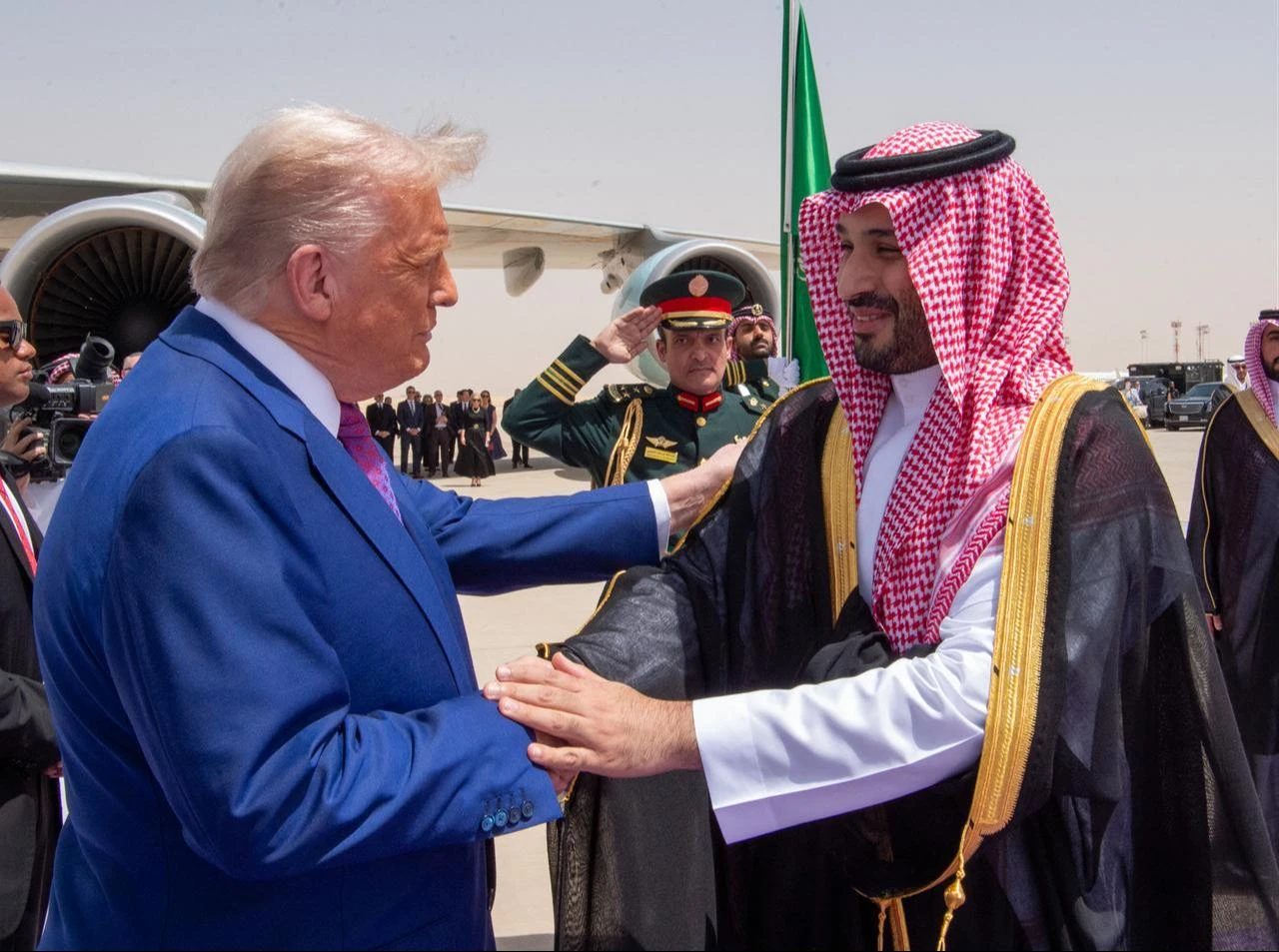 Saudi Crown Prince Mohammed bin Salman (R) welcoming US President Donald Trump (L) upon his arrival in Riyadh on May 13, 2025. (AFP Photo/Saudi Royal Palace/BANDAR AL-JALOUD)