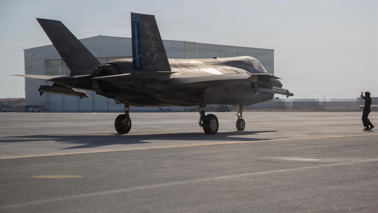A U.S. Marine ground guides an F-35B Lightning II aircraft, July 23, 2026, in the U.S. Central Command area of responsibility. (Photo via U.S. Marine Corps)