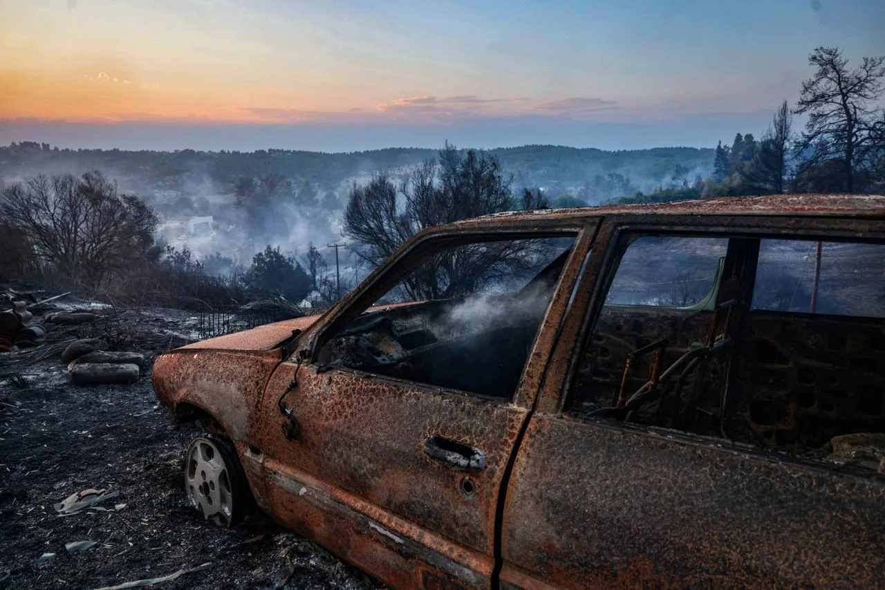 Burnt car after a wildfire near the village of Siviri, northern Greece, on August 13, 2026. (AFP Photo)