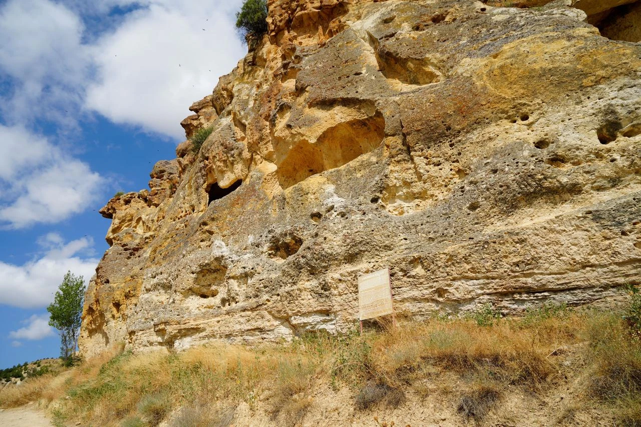 The weathered rock facade of Cakirkaya Monastery, which is believed to date from between the 13th and 15th centuries, is seen in Gumushane, northeastern Türkiye. (IHA Photo)