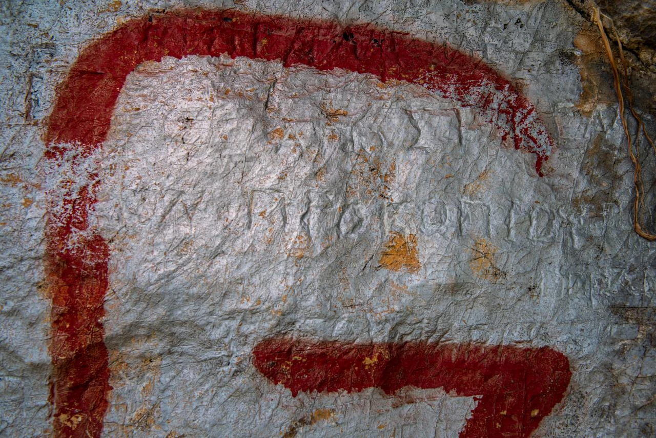 This photograph shows a graffiti inside the Caves in Bornova Homeros Valley, believed to be where famous Greek Poet Homer lived and wrote the Iliad and the Odyssey, in Izmir on August 7, 2026. (AFP Photo)
