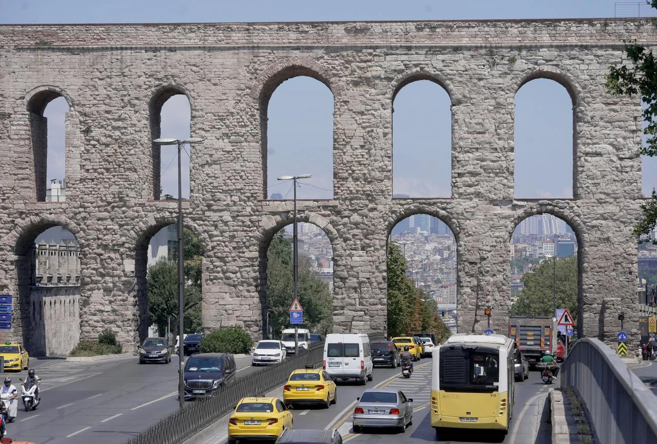 The historic Bozdogan Aqueduct, also known as the Valens Aqueduct, rises above a busy road in Istanbul, Türkiye. (AA Photo)