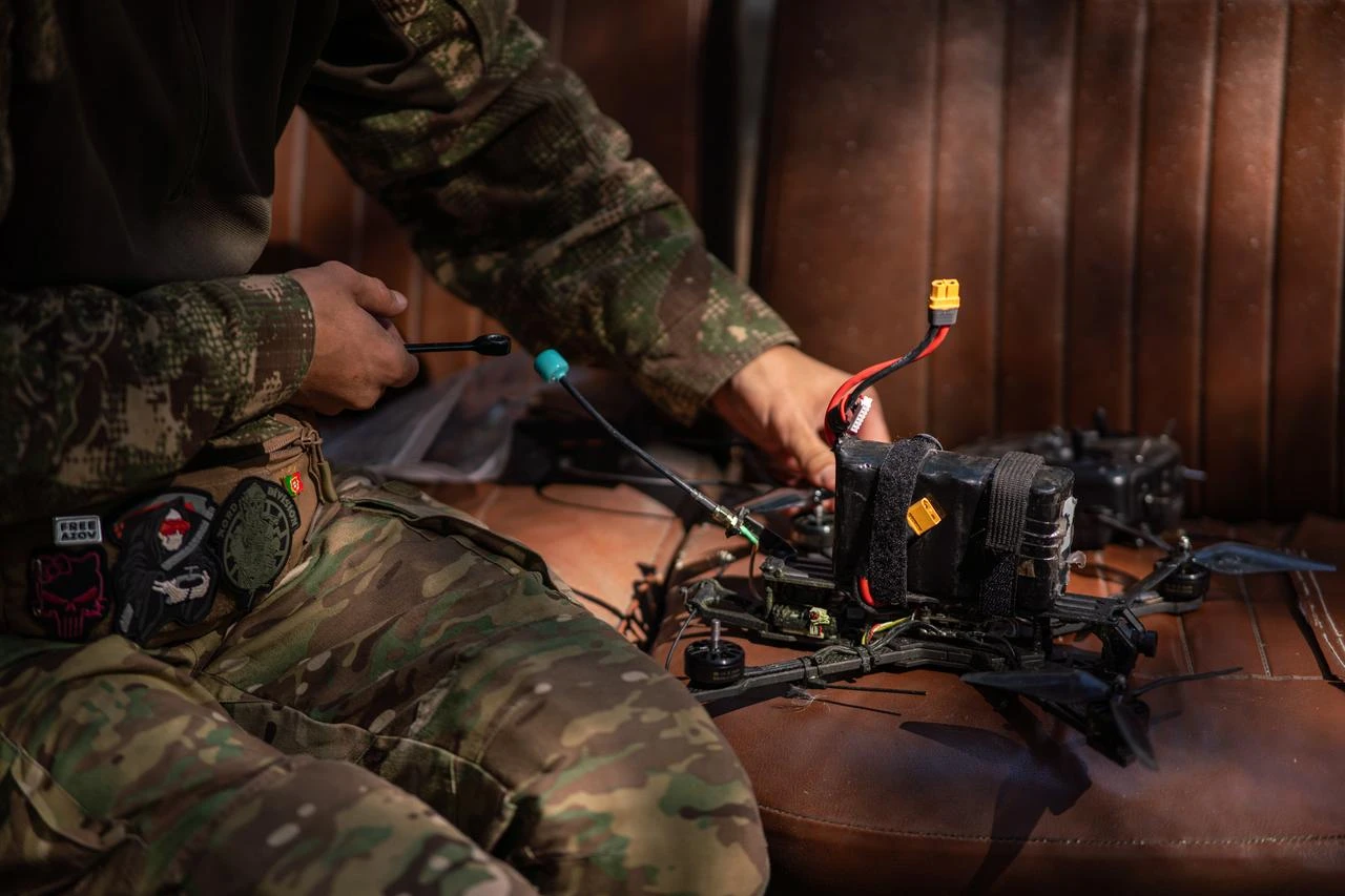 Servicemen of the 13th Brigade of the National Guard of Ukraine "Khartiia" operate First-Person View (FPV) drones during a practical training session simulating real combat tactics in Kharkiv Oblast, Ukraine, Aug. 15, 2026. (AA Photo)