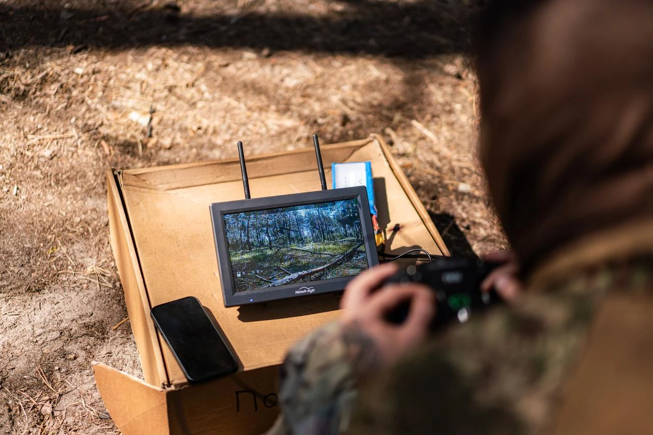 Servicemen of the 13th Brigade of the National Guard of Ukraine "Khartiia" operate First-Person View (FPV) drones during a practical training session simulating real combat tactics in Kharkiv Oblast, Ukraine, Aug. 15, 2026. (AA Photo)