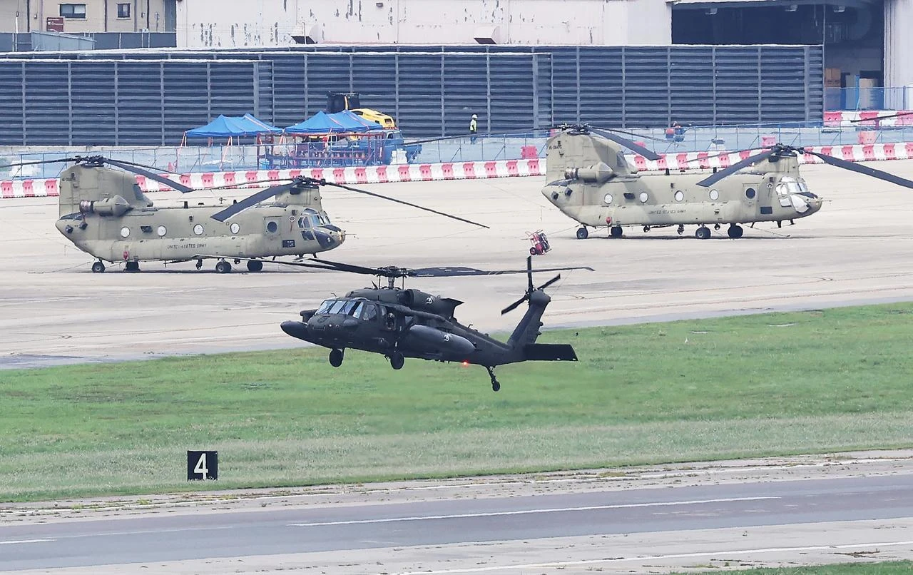 A US Army UH-60 Black Hawk helicopter flies at Camp Humphreys in Pyeongtaek on August 17, 2026. (Photo by YONHAP / AFP)