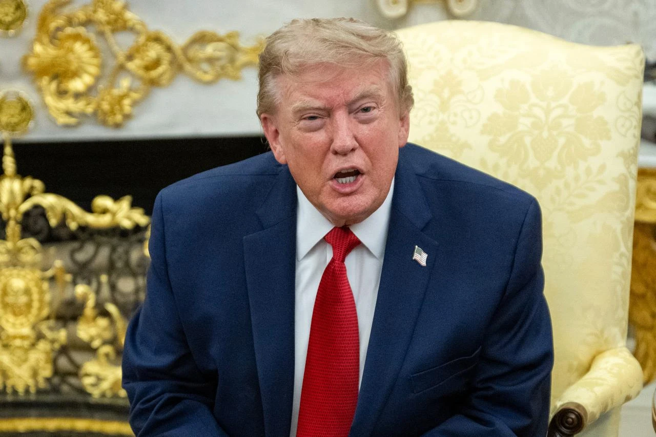 US President Donald Trump speaks as he meets with lifeguard Ryder Williams in the Oval Office of the White House in Washington, DC, on August 17, 2026. (AFP Photo)