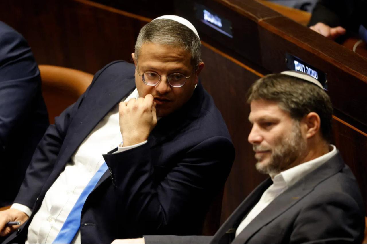 Right-wing Knesset members Itamar Ben-Gvir (L) and Bezalel Smotrich, attend a special session at the Knesset Israels parliament, to approve and swear in a new right-wing government, in Jerusalem, December 29, 2022. (AFP Photo)