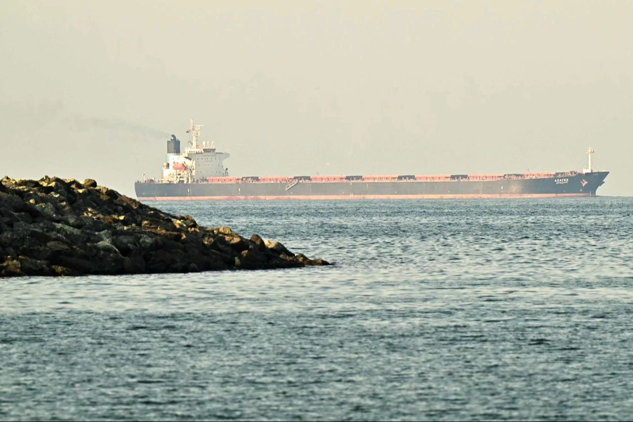A cargo ship is pictured off coast city of Fujairah, in the Strait of Hormuz in the northern Emirate on February 25, 2026. (AFP Photo)