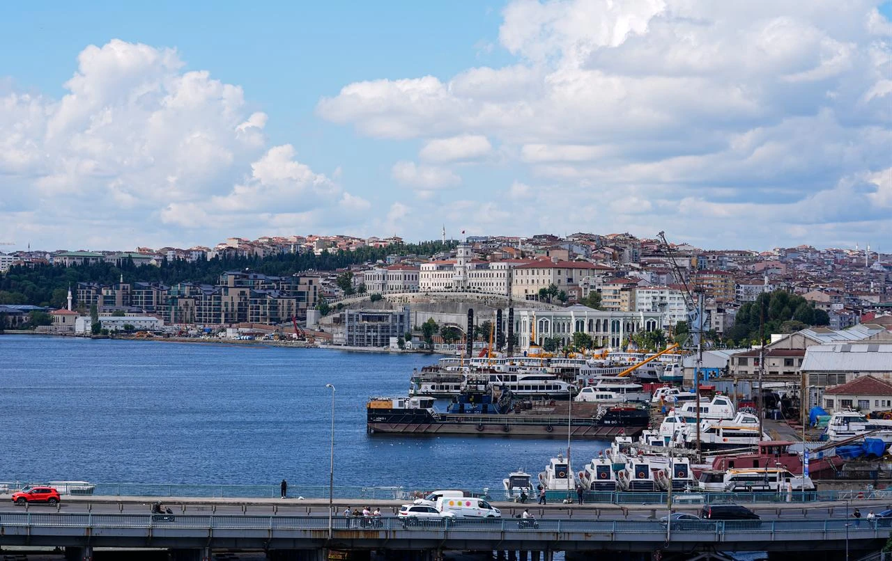 Clouds drift over Istanbul as boats and buildings line the waterfront along the Golden Horn, Aug. 16, 2026. (AA Photo)