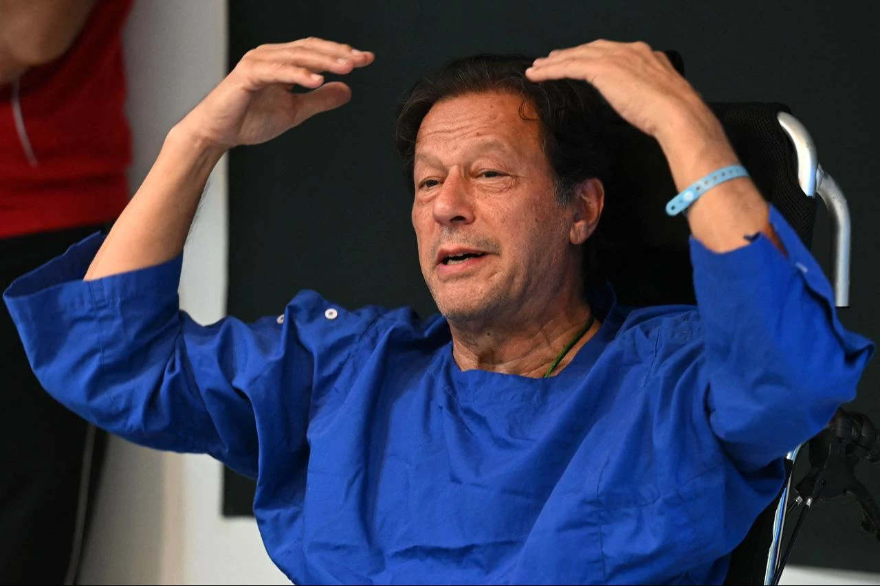 In this picture taken on on November 4, 2022, Pakistan's former prime minister Imran Khan addresses the media representatives at a hospital in Lahore, a day after an assassination attempt on him. (AFP Photo)