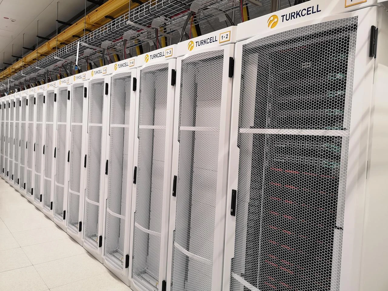Rows of server cabinets at state-run Turkcell’s data center in Izmir, Türkiye. (Photo via media.turkcell.com.tr)