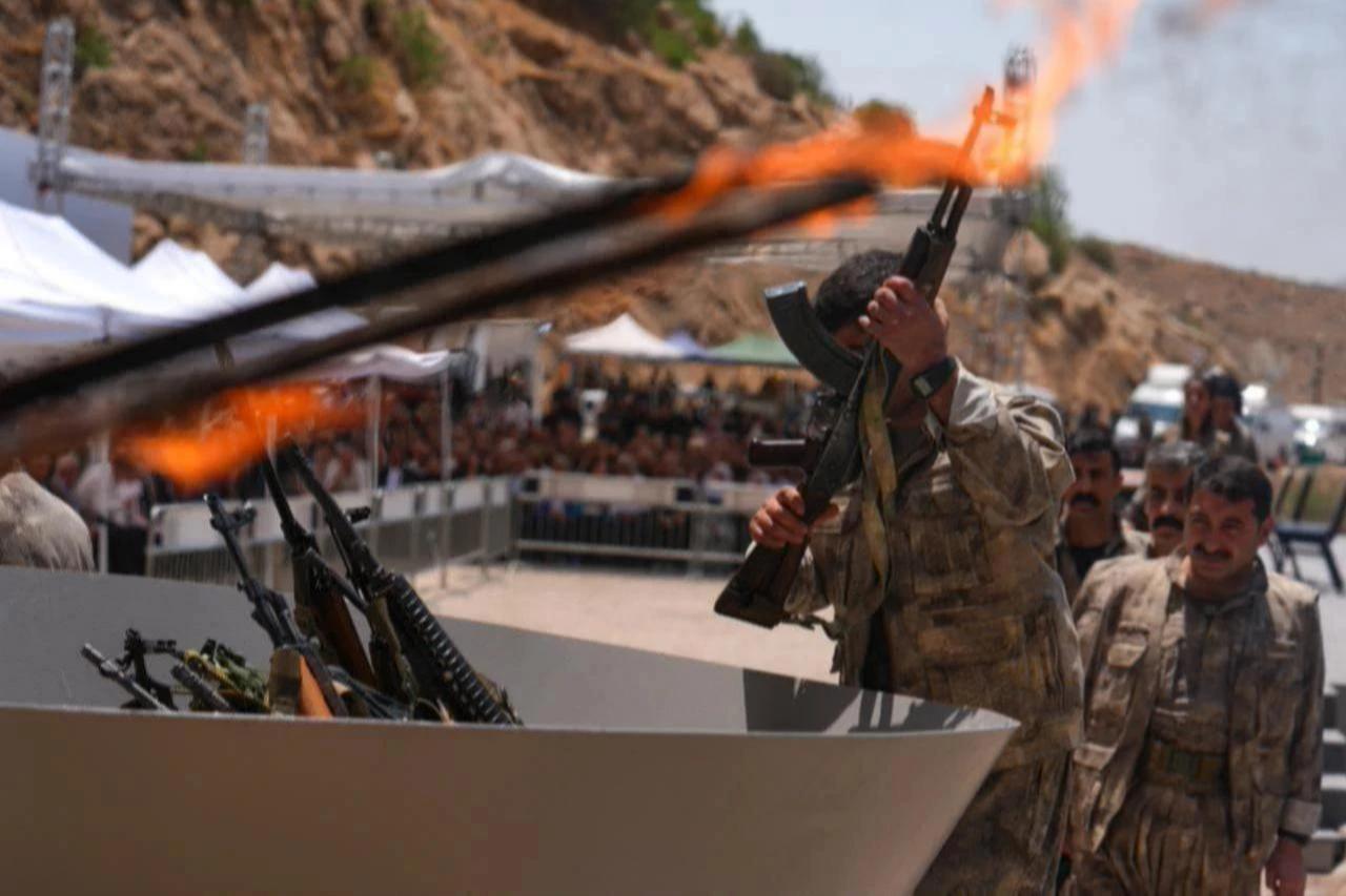The first group of PKK terrorists lays down and destroys their weapons in Sulaymaniyah, northern Iraq, July 11, 2025. (AA Photo)